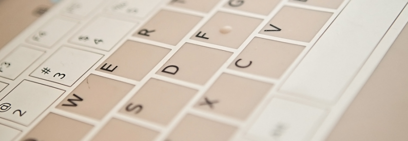 A close-up of a QWERTY computer keyboard.