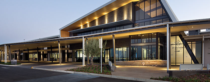 An exterior view of St Stephen’s Hospital in Hervey Bay at dusk.